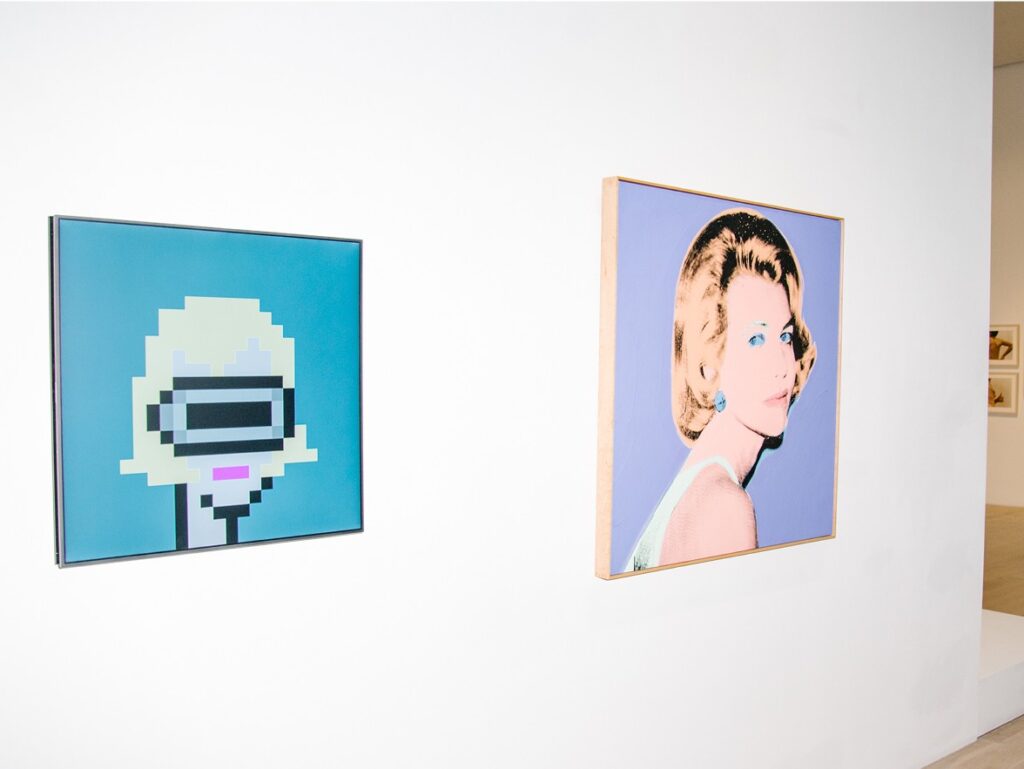 CryptoPunk #305 displayed beside Andy Warhol's American Lady at ICA Miami, a bluechip NFT in a museum setting